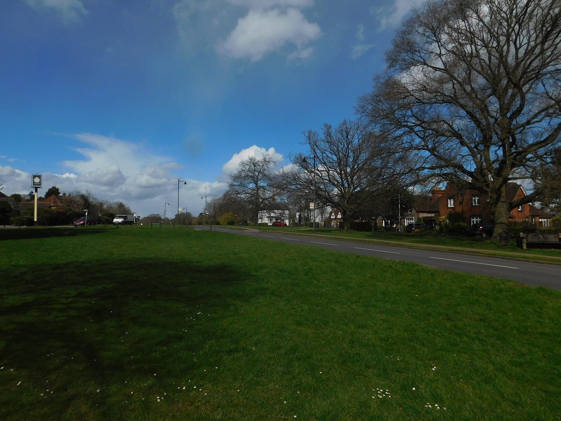 The village green at Croxley Green, with the New Road frontage beyond the grass